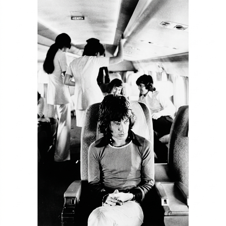 Mick Jagger On Tour Plane (1972) — Jim Marshall — Framed Print